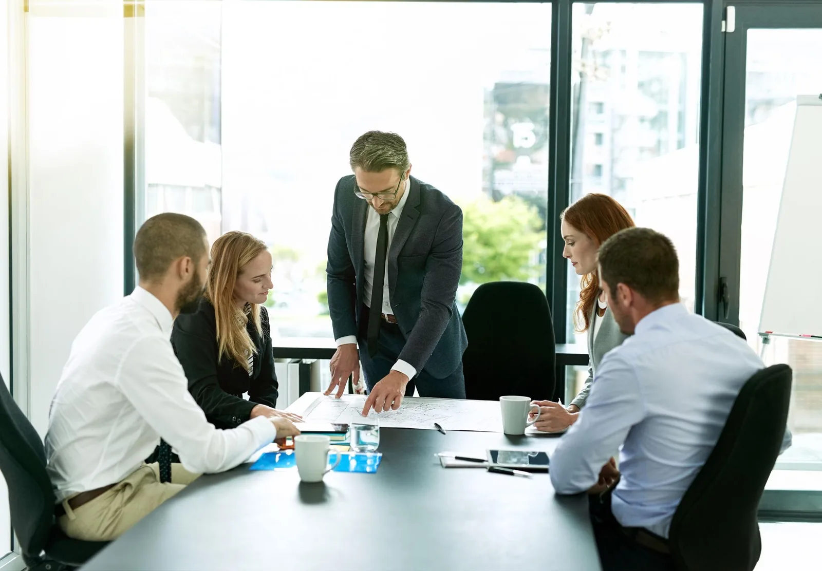 QuantaStrat consultants working with a client